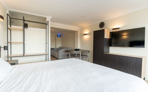 White Mountains Retreats with City View: Building, Furniture, Comfort, Cabinetry, Wood, Bed Frame, House, Interior Design, Lamp, Bed