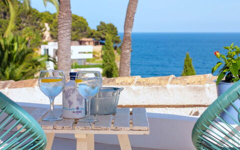 Cala Advocat: Water, Sky, Water Resources, Mountain, Azure, Plant, Coastal And Oceanic Landforms, Lake, Beach, Horizon