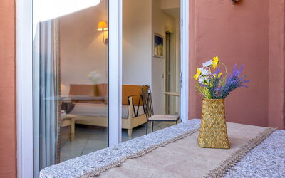 Isola Rossa 717: Furniture, Property, Building, Plant, Interior Design, Door, Houseplant, Flower, Chair, House