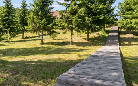 Villa Onni: Bed, Furniture, Bedroom, Interior Design, Bedding, Bed Sheet, Flooring, Wood, Floor, Room