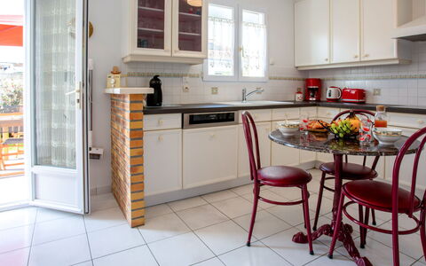 Les Pêcheries: Countertop, Cabinetry, Furniture, Property, Window, Kitchen Appliance, Kitchen, Kitchen Stove, Wood, Interior Design