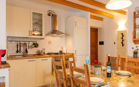 Giove: Property, Cabinetry, Table, Countertop, Chair, Orange, Wood, Kitchen, Interior Design, Tableware