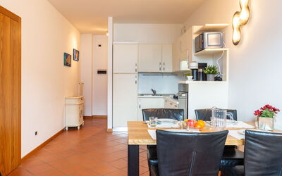 La Baia 615.1: Property, Furniture, Table, Wood, Cabinetry, Flooring, Interior Design, Floor, Door, Living Room
