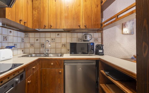 Masserini View Apartment: Wood, Countertop, Flooring, Kitchen, Major Appliance, Cabinetry, Interior Design, Floor, Kitchen Appliance, Ceiling