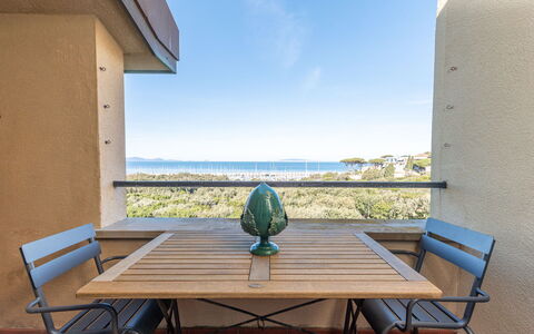 Punta Ala 130: Table, Sky, Furniture, Property, Building, Water, Azure, Wood, Plant, Shade
