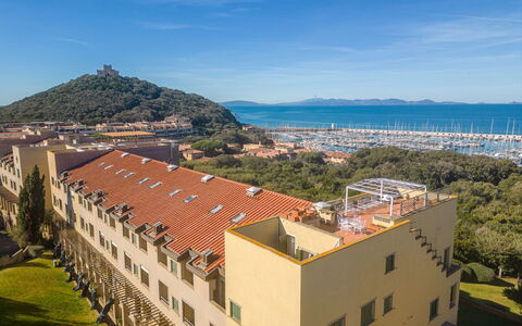 Punta Ala 130: Sky, Building, Property, Water, Cloud, Window, Plant, Mountain, Tree, Architecture