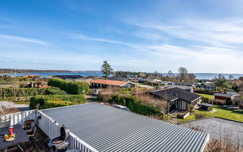 Sylvia - 450M from the Sea: Roof, Home, Door, Cottage, Shade, Siding, Yard, Estate, Backyard