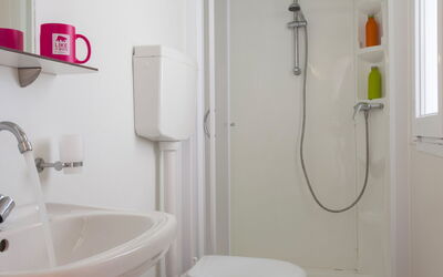 Camping Village Capo D'Orso 59.2: Plumbing Fixture, Property, Toilet Seat, Bathroom Sink, Product, Tap, Sink, Bathroom, Purple, Toilet