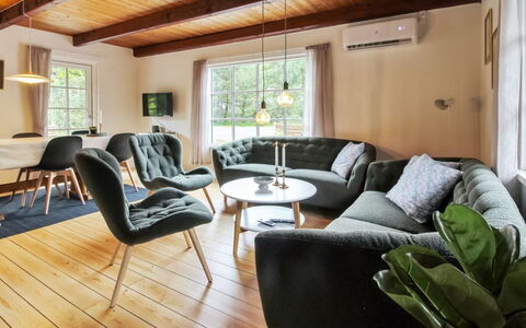 Hila: Furniture, Interior Design, Flooring, Floor, Wood, Couch, Living Room, Wood Flooring, Table, Room