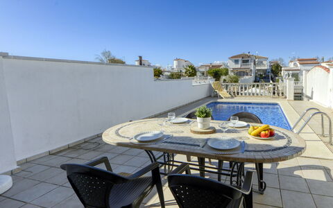 Calima: Plant, Sky, Property, Water, Tree, Azure, Building, Architecture, Arecales, Residential Area
