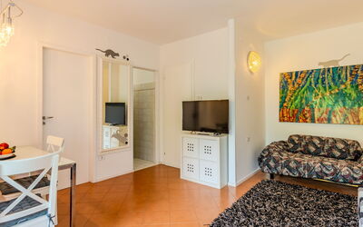 Condominio Garda 101.3: Cabinetry, Wood, Flooring, House, Floor, Living Room, Hardwood, Hall, Wood Stain, Laminate Flooring
