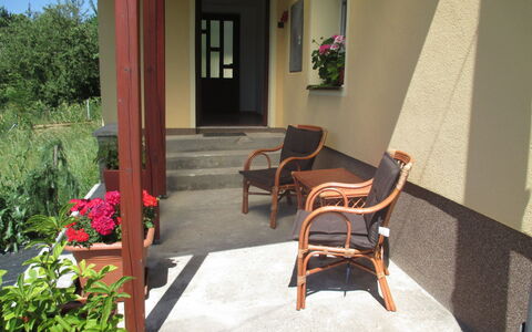 Pod Ostaší: Plant, Building, Window, Houseplant, Shade, Flowerpot, Chair, Interior Design, Orange, Residential Area