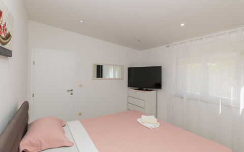 Villa Dalmatina: Bed, Furniture, Interior Design, Bedroom, Floor, Flooring, Wood, Ceiling, Bedding, Bed Sheet