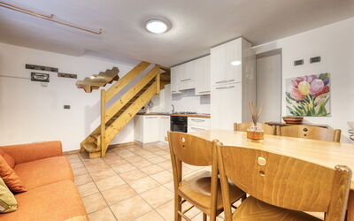 Appartamento in Centro Paese Ronco 1: Furniture, Table, Wood, Chair, Flooring, Floor, Plant, Living Room, Hardwood, Real Estate