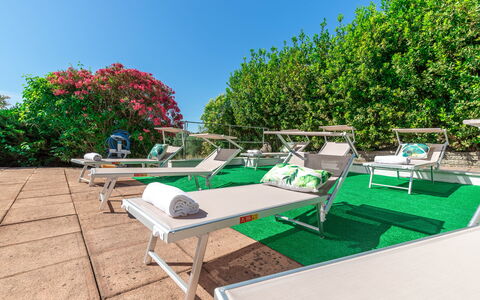 Villa La Pagliarina: Sky, Plant, Outdoor Furniture, Shade, Urban Design, Grass, Outdoor Bench, Outdoor Table, Leisure, Landscape