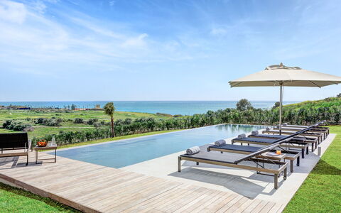 Villa Corallo - Sea Front | By Rocco Forte Villas: Sky, Cloud, Water, Plant, Outdoor Furniture, Shade, Tree, Seaside Resort, Leisure, Eco Hotel