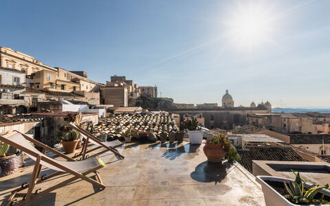 Terrazza Di Erika: Sky, Building, Urban Design, Plant, Flowerpot, Residential Area, House, Landscape, Cloud, Houseplant