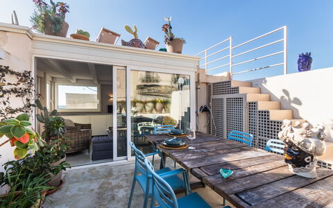 Terrazza Di Erika: Sky, Plant, Table, Building, Wood, Houseplant, Wall, House, Residential Area, Shade