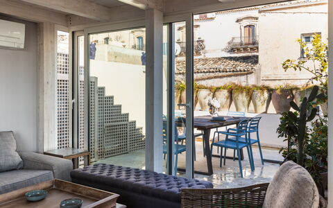Terrazza Di Erika: Table, Furniture, Property, Building, Couch, Wood, Shade, Interior Design, Outdoor Furniture, Floor