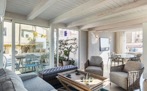 Terrazza Di Erika: Table, Furniture, Property, Couch, Building, Houseplant, Plant, Lighting, Wood, Interior Design