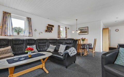 Pernilla - 2Km from the Sea: Furniture, Chair, Living Room, Hardwood, Houseplant, Couch, Armrest, Coffee Table