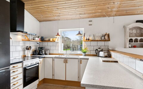 Kara - 450M from the Sea: Kitchen, Countertop, Kitchen Appliance, Cabinetry, Flooring, Interior Design, Wood, Major Appliance, Kitchen Sink, Ceiling