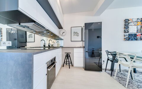 Kęty: Cabinetry, Furniture, Building, Countertop, Interior Design, Kitchen, Chair, Door, Floor, Flooring