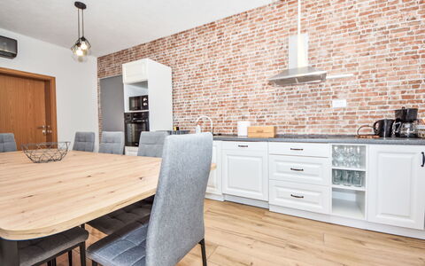Vulelija Holiday Home: Furniture, Cabinetry, Table, Countertop, Wood, Chair, Building, Interior Design, Kitchen, Lighting