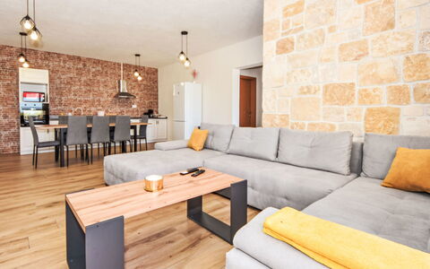 Vulelija Holiday Home: Table, Property, Furniture, Couch, Picture Frame, Wood, Comfort, Interior Design, Orange, Living Room