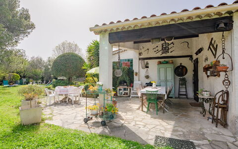 La Palombière: Plant, Property, Sky, Table, Flowerpot, Building, Chair, Outdoor Table, Tree, Door