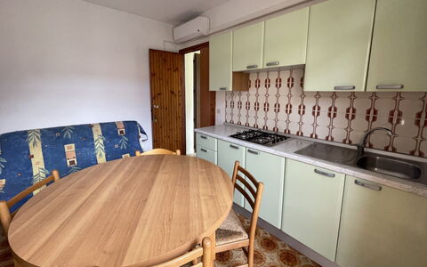 Rosolina Mare 628: Furniture, Cabinetry, Property, Table, Countertop, Kitchen Stove, Wood, Sink, Lighting, Interior Design