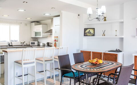 Los Almendros: Table, Furniture, Property, Chair, Interior Design, Wood, Lighting, Floor, Flooring, Living Room