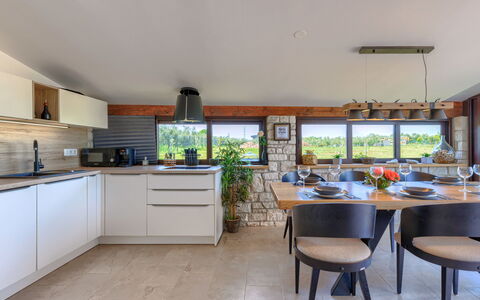 Claudia: Cabinetry, Furniture, Countertop, Building, Plant, Kitchen, Table, Houseplant, Kitchen Stove, Wood