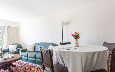 L'Antonia: Table, Furniture, Building, Plant, Couch, Flower, Interior Design, House, Chair, Tablecloth