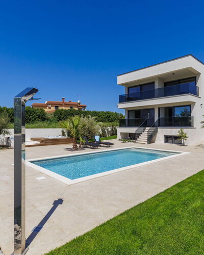Villa Sandro: Plant, Sky, Building, Property, Tree, Window, Land Lot, Shade, Urban Design, Swimming Pool