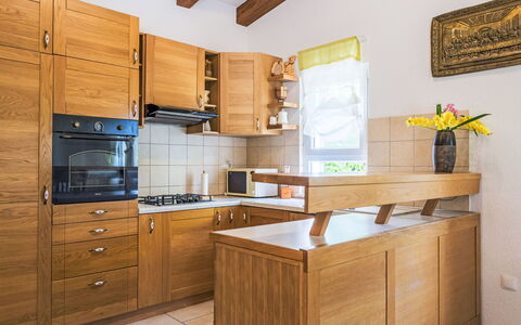 Vila Milančić: Cabinetry, Countertop, Property, Furniture, Building, Drawer, Picture Frame, Wood, Kitchen Appliance, Kitchen