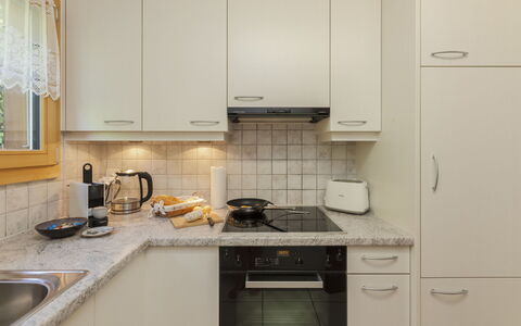 Chalet Anita: Kitchen, Countertop, Kitchen Appliance, Cabinetry, Major Appliance, Interior Design, Furniture, Wood, Kitchen Sink, Flooring