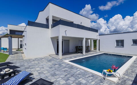 Blue Rose: Sky, Cloud, Building, Property, Blue, Azure, House, Window, Swimming Pool, Shade