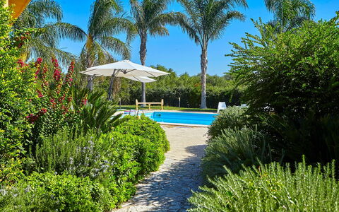 Villa Selinunte: Plant, Water, Property, Plant Community, Sky, Azure, Tree, Natural Landscape, Shade, Vegetation