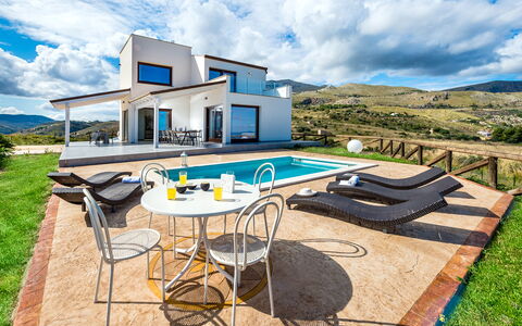 Villa Azzurra: Cloud, Sky, Table, Furniture, Building, Azure, Outdoor Furniture, Chair, Interior Design, Shade