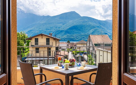 Re16 Regina: Cloud, Table, Sky, Furniture, Building, Property, Window, Mountain, Chair, Interior Design