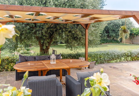 Cyca Holiday Home: Plant, Flower, Table, Property, Furniture, Botany, Outdoor Table, Shade, Outdoor Furniture, Yellow