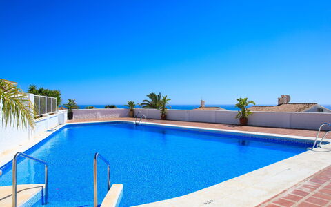 Lind: Water, Sky, Property, Swimming Pool, Blue, Tree, Outdoor Furniture, Shade, Rectangle, Building