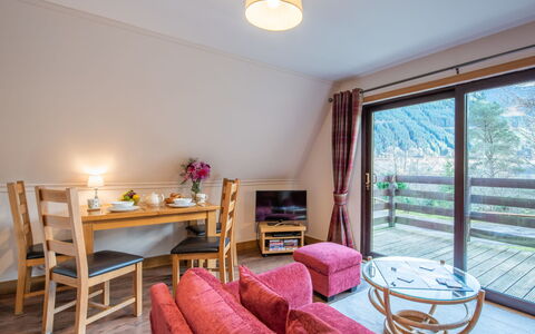 Loch Lochy Retreat: Kitchen & Dining Room Table, Hardwood, Resort, Chair, Hotel, Living Room, Coffee Table, Eco Hotel, Wood Flooring, Armrest