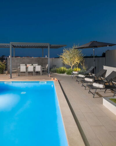 Freya: Water, Plant, Swimming Pool, Sky, Building, Shade, Outdoor Furniture, Condominium, House, Chair