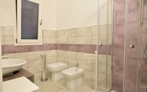 Villa Del Sole In Budoni Sea View: Toilet Seat, Bathroom, Purple, Toilet, Plumbing Fixture, Bathroom Sink, Interior Design, Floor, Flooring, Building