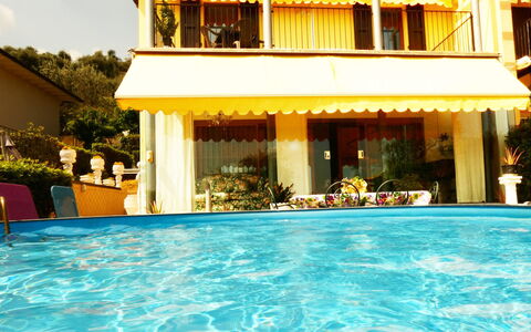 Villa Paradiso: Water, Property, Swimming Pool, Building, Azure, Plant, Window, Leisure, Tree, Shade