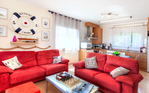 Fane de Baix i: Couch, Property, Furniture, Table, Living Room, Interior Design, Studio Couch, Lighting, Orange, Pillow