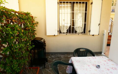 Casa Vacanze Sabrina: Floor, Furniture, Door, Wood Stain, Flowerpot, Shade, Chair, Houseplant, Home Door, Balcony