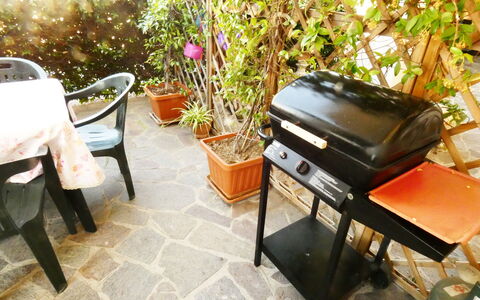 Casa Vacanze Sabrina: Furniture, Outdoor Furniture, Outdoor Table, Chair, Flowerpot, Shade, Garden, Backyard, Houseplant, Umbrella
